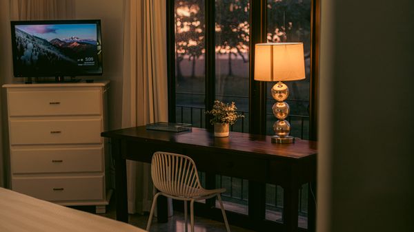 Master bedroom with a view of the garden and stunning sunsets.