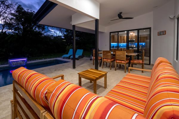 bright living room overlooking the serene pool area