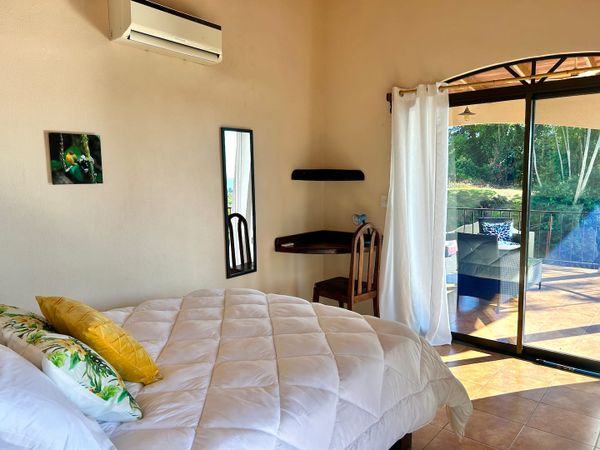 Bedroom #2 has A/C, corner desk, ocean view patio access.