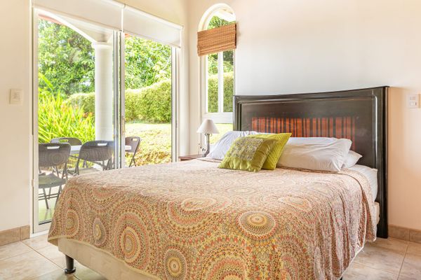 Bedroom #2 has a queen-size be, air conditioning and access to the outdoor patio.