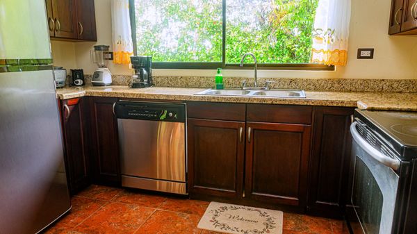 pacious kitchen with ample room for cooking and storage, perfect for preparing meals