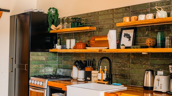 A sleek, modern kitchen with high-end finishes and stylish appliances.