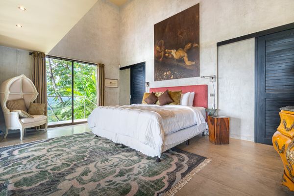 Owner's Suite has large en-suite bathroom, king size bed, closet, A/C, access to one of the numerous decks and walkway to the pool.