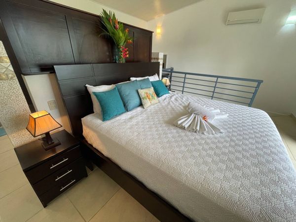 Owner's Suite has king-size bed, en suite bathroom, private balcony.