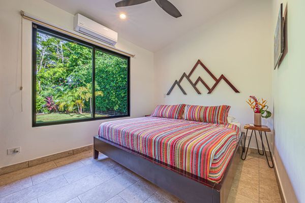 Bedroom 2 has king-size bed, A/C and ceiling fan.