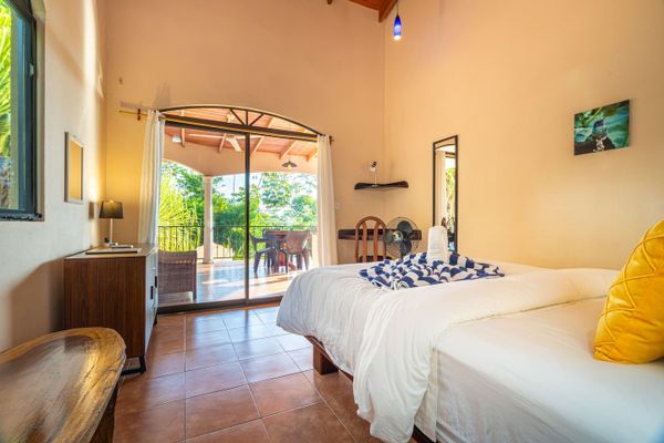 Bedroom #3 has A/C, corner desk, ocean view patio access.