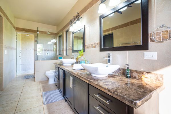 Master bedroom full bathroom with double sinks, indoor and outdoor shower