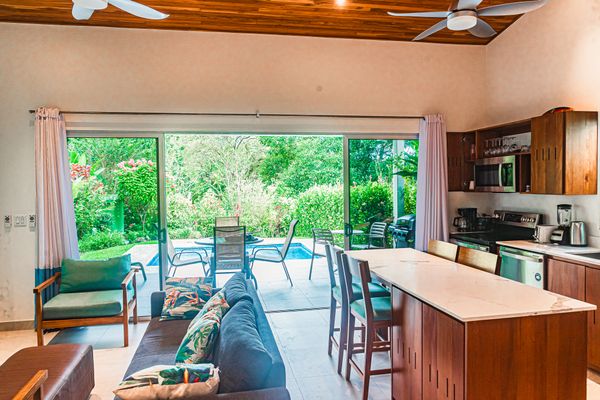 Open-plan design creating a seamless flow between the living room and kitchen.