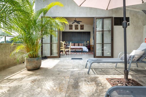 Penthouse level with jacuzzi, sun chairs and Suite #2.
