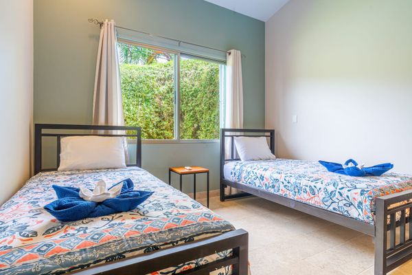 Bedroom #3 has two single beds.