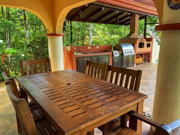 well-equipped barbecue space for cooking and entertaining outdoors.