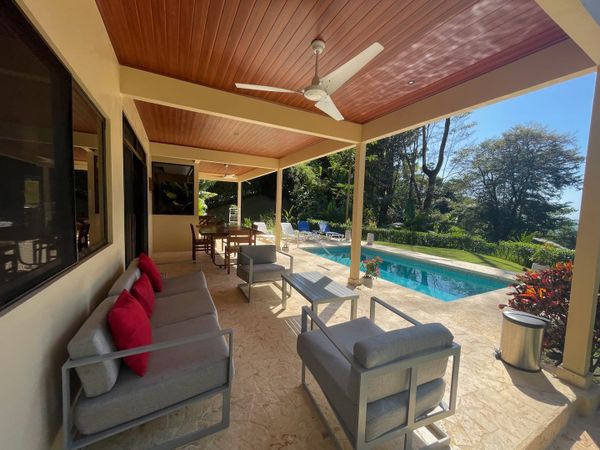 spacious lounge area with direct access to the pool, perfect for relaxation.