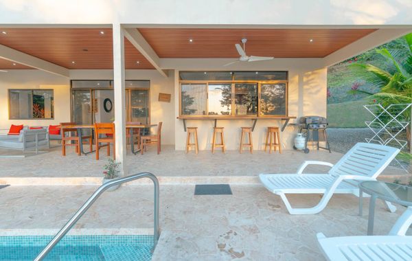 A stylish BBQ area by the pool, perfect for cooking and relaxing with friends or family