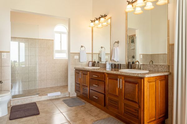 modern bathroom with dual sinks and mirrors, combining functionality and style.