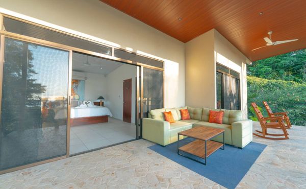 A chic outdoor lounge area, blending modern comfort with nature’s tranquility.