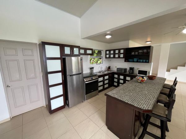 Well-equipped and designed kitchen allows easy flow and socializing while preparing food/drinks.