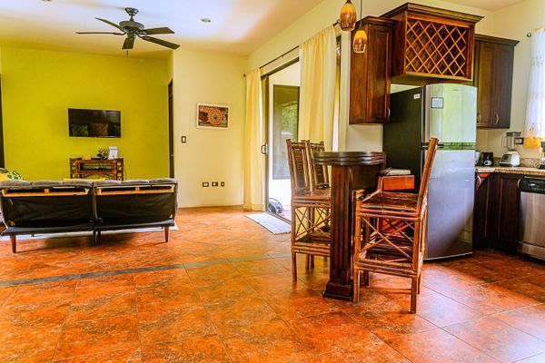 cozy kitchen features warm tones and functional design, creating a welcoming space to cook and gather