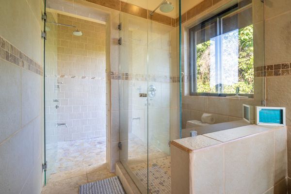 Master bedroom full bathroom with double sinks, indoor and outdoor shower