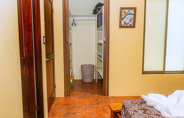 A bright, functional room with a large wardrobe for a clean and organized space.
