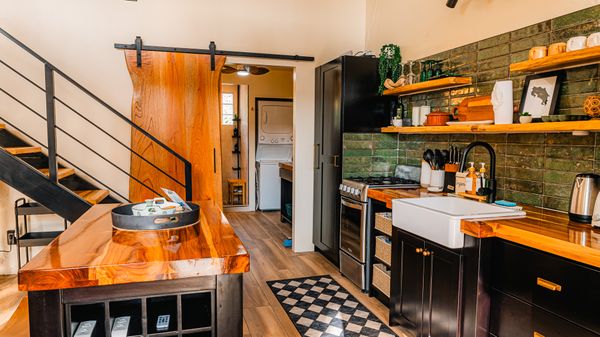 A stylish, well-appointed kitchen with a harmonious mix of textures and sleek design.