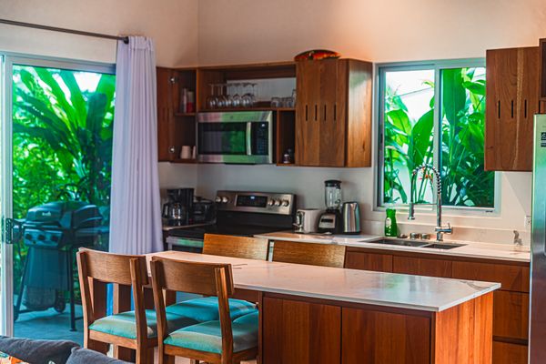 Contemporary kitchen with island seating and modern appliances.