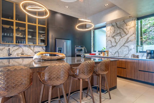A luxurious modern kitchen with sophisticated finishes and an inviting atmosphere.