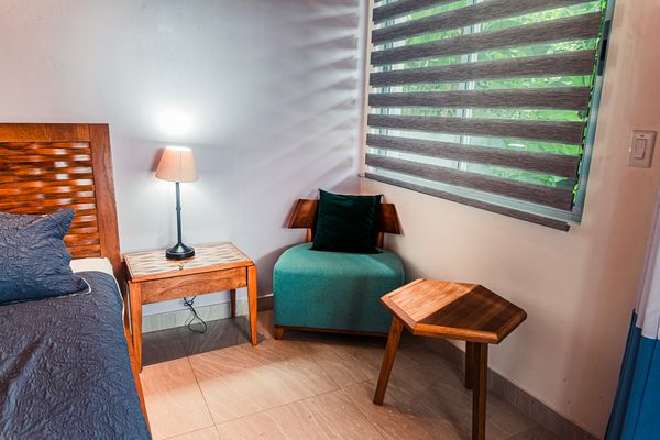 Cozy reading nook by the window, perfect for quiet moments.