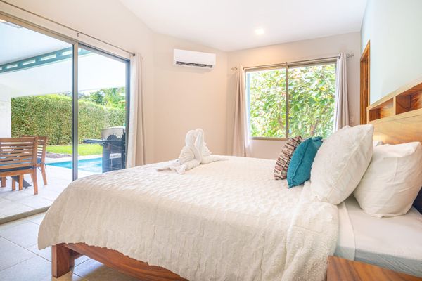 Owner's Suite has en-suite private bathroom and access to the patio and private pool (A/C and ceiling fan also)