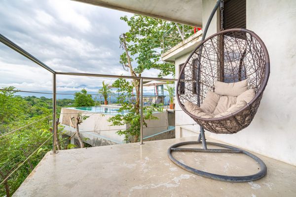 calming space to appreciate the outdoors, surrounded by lush greenery and fresh air.