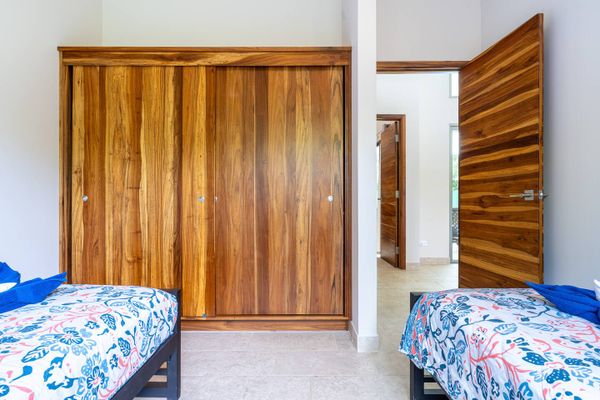 Bedroom #3 has two single beds.