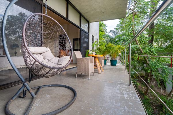 calming space to appreciate the outdoors, surrounded by lush greenery and fresh air.