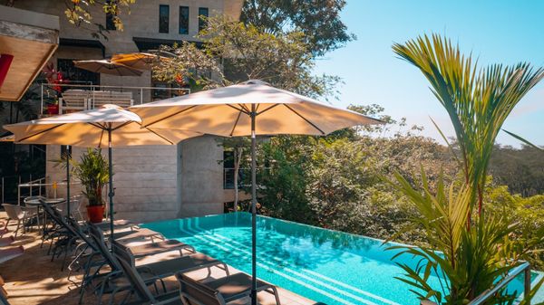 Private pool with outdoor bar area.