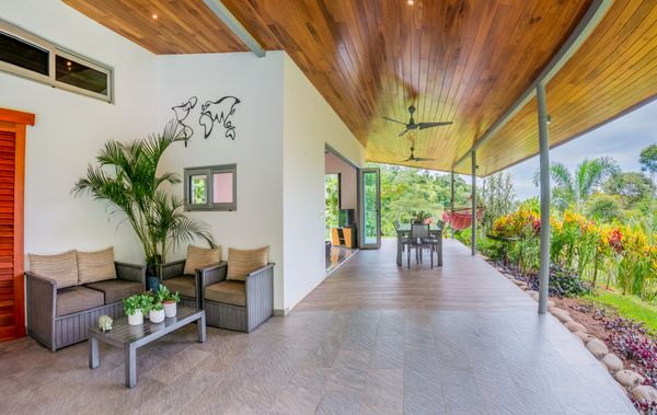 A cozy seating area next to the pool, perfect for relaxing and enjoying the view.