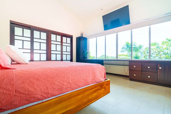 Owner's Suite is spacious, has a king-size bed, A/C, TV, en-suite/private bathroom.