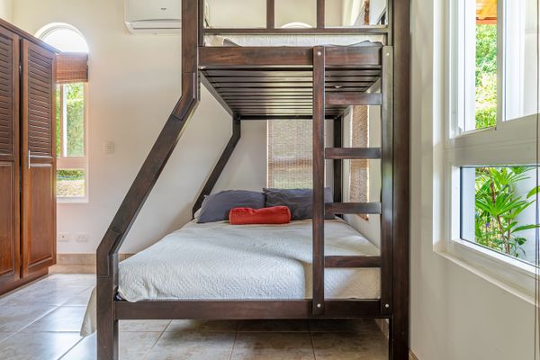 spacious room with a cozy bunk bed, perfect for extra sleeping space.