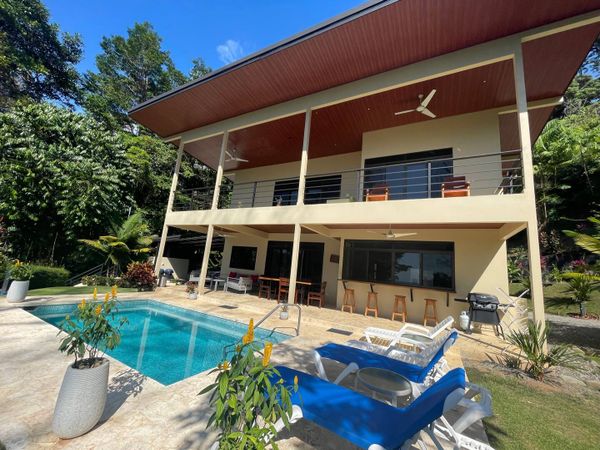 Spacious, comfortable poolside chairs, perfect for lounging and sunbathing.