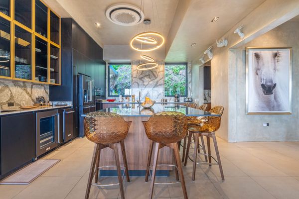 A beautifully designed kitchen that seamlessly blends modern elegance with top-tier functionality.