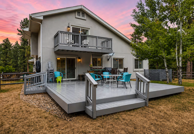 Scenic mountainside home with deck and yard