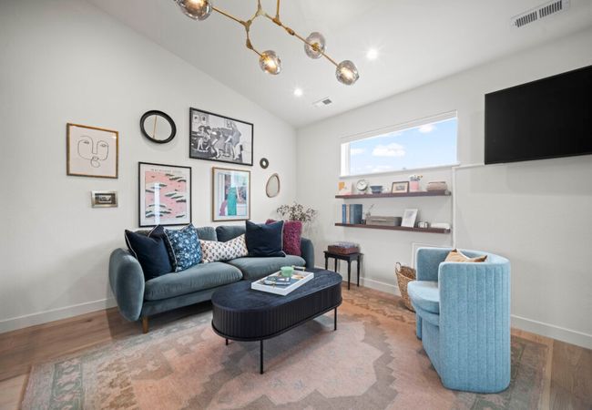 Modern studio with workspace and kitchenette