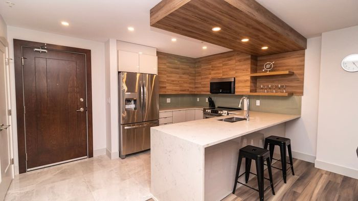 Prepare meals with ease in the modern, fully-equipped kitchen, complete with top-tier appliances and sleek finishes.