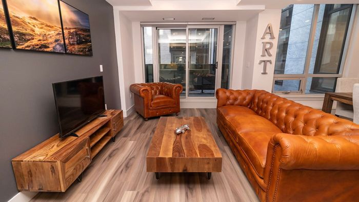 Unwind in Elegance – Spacious Living Area with Stunning Cityscape Views.