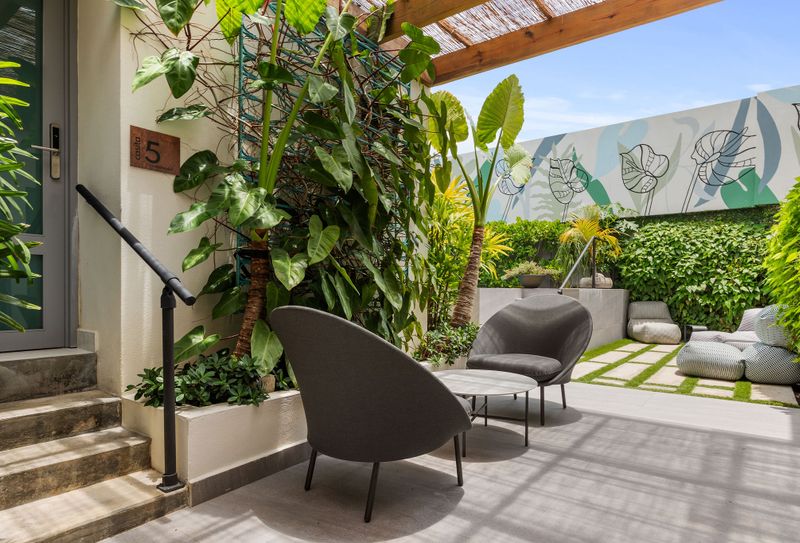 Luxurious yet homey exterior space at an Airbnb rental, blending indoor comfort with the allure of nature.