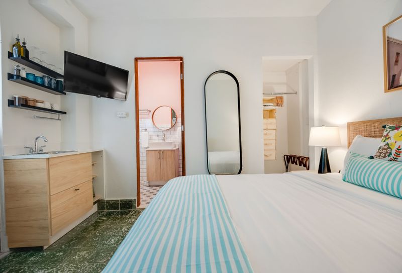 Unwind in this serene and minimalist chamber with a calm vibe.