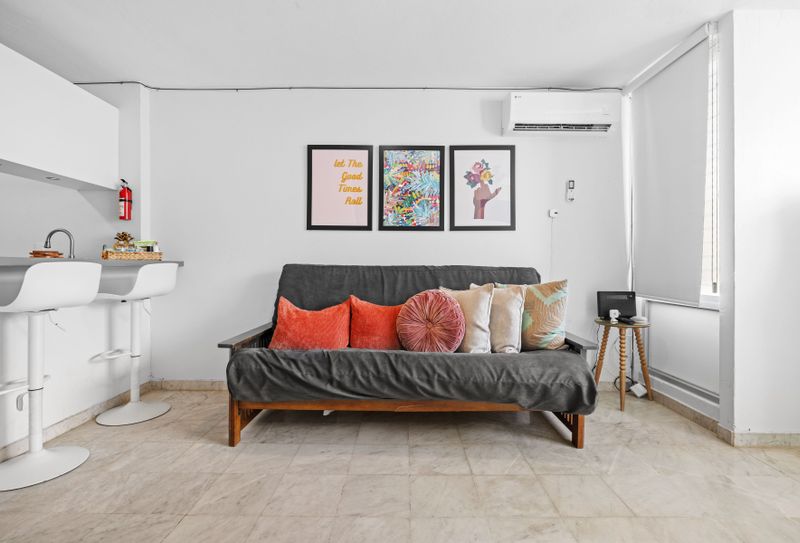 Step into a vibrant living space where contemporary art meets comfort.