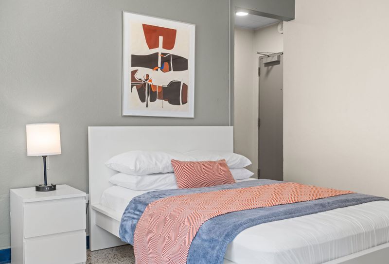 Olimpo | Room For Families 5 Settle into a peaceful night's sleep in this tranquil bedroom. The soft lighting and comfortable bedding are perfect for unwinding and recharging.
