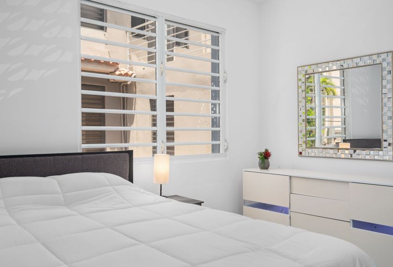 Bright and airy bedroom with a comfortable bed and plenty of storage space.