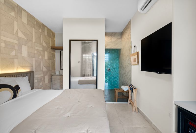 Well-appointed bedroom with a comfortable bed and a stylish design.
