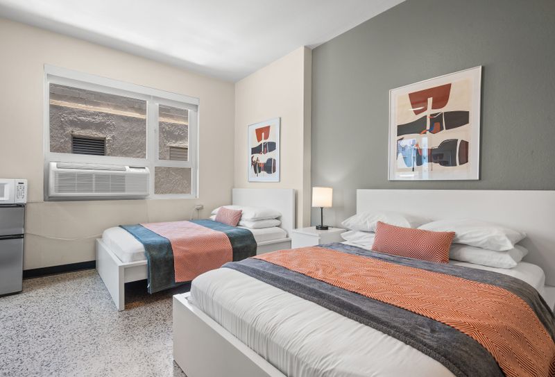 Settle into a peaceful night's sleep in this tranquil bedroom. The soft lighting and comfortable bedding are perfect for unwinding and recharging.