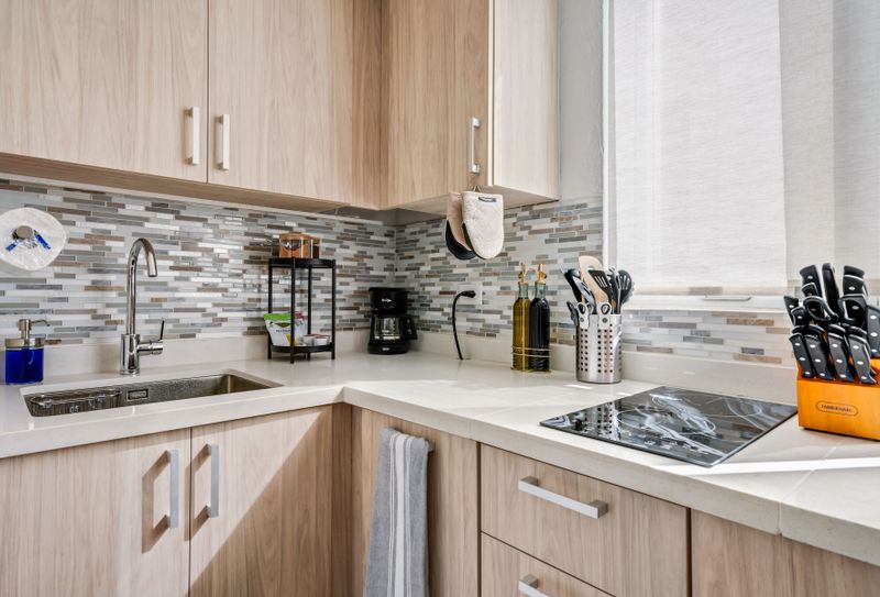 A sleek kitchen with top-of-the-line appliances, perfect for preparing your favorite meals.