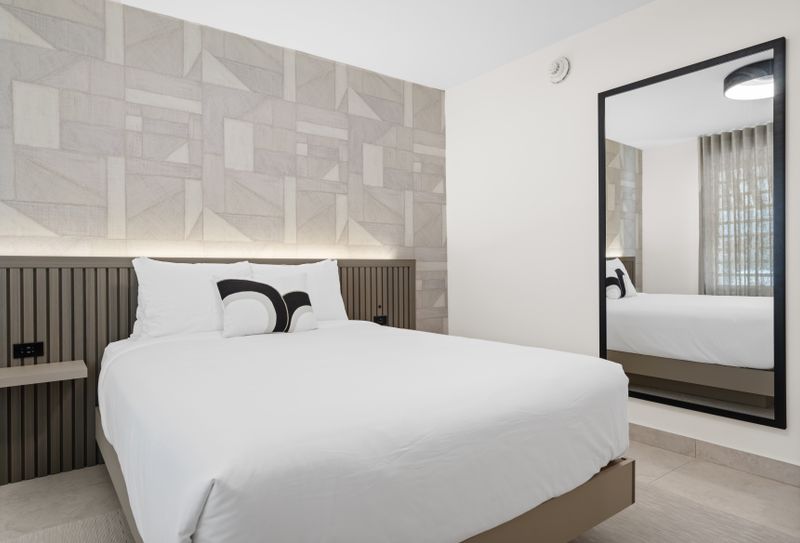 Indulge in ultimate comfort in this luxurious bedroom, showcasing a plush bed and elegant decor